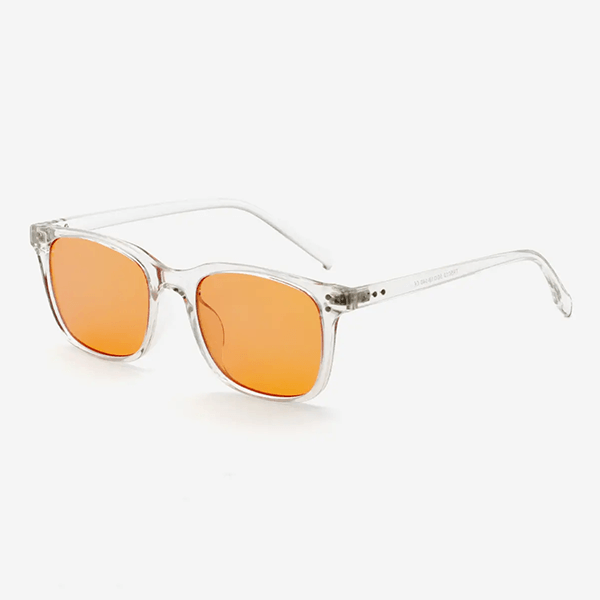 Blålysbriller med gjennomsiktig ramme og oransje linser i moderne wayfarer-stil